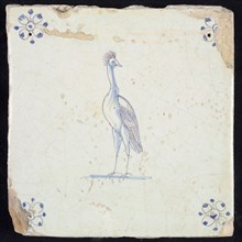 Animal tile, standing crane to the left, in purple and blue on white, corner motif spider, wall tile tile sculpture ceramic