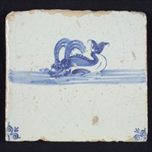 Animal tile, water-spouting dolphin in continuous water to the left, in blue on white, corner motif of ox-head, wall tile