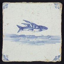 Animal tile, flying fish above running water to the right, in blue on white, corner motif oxen head, wall tile tile sculpture