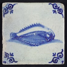 Animal tile, unknown fish in water to the right, in blue on white, corner motif of ox's head, wall tile tile sculpture ceramic