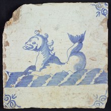 Animal tile, sea-washed in continuous water to the left, in blue on white, corner motif of ox-head, wall tile tile sculpture