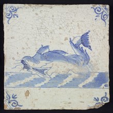 Animal tile, marine in continuous water to the left, in blue on white, corner motif of ox's head, wall tile tile sculpture