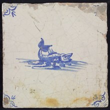 Animal tile, sea-based in water to the right, in blue on white, corner motif of ox-head, wall tile tile sculpture ceramic