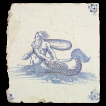 Sea creature tile, in blue on white, naked man with fish tail in water to the left, in hand saber, corner motif spider, wall