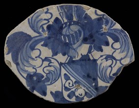 Fragment majolica dish, blue on white, heraldic image, helmeted escutcheon with diagonal division, above dark, under light with