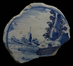 Fragment majolica plate, blue on white, landscape with large tree and in the distance tower, plate crockery holder soil find