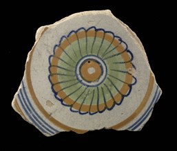 Fragment of the majolica dish, polychrome, concentric circles containing rosette, plate crockery holder soil find ceramic