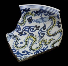 Two fragments of majolica scale, yellow and blue on white, with Oriental dragon as decor, dish plate crockery holder soil find