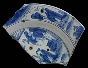 Two fragments of faience plate, blue on white, landscapes and chinesen on edge and mirror, dish plate crockery holder soil find