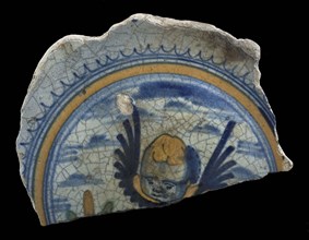 Fragment majolica dish, yellow, green and blue on white, winged cherub cup, plate dish crockery holder soil find ceramic
