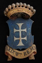 Carved wooden crowned coat of arms including the name Fred.K Wm. Remy, coat of arms information form wood carving sculpture