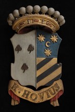 Carved wooden crowned coat of arms including the name H. Hovius, coat of arms informative form carvings sculpture visual