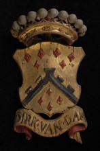 Carved wooden crowned coat of arms including the name Dirk van Dam, coat of arms informative form carvings sculpture sculpture