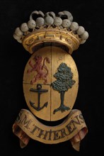 Carved wooden crowned coat of arms including the name S.M. Thierens, coat of arms informative form carvings sculpture sculpture