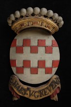 Carved wooden crowned coat of arms including the name E. Haest. V. Grevenb., coat of arms information form carvings sculpture