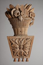Carved wooden basket with flowers, fragment of paneling, ornament wood carving sculpture footage wood