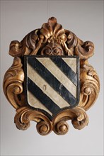 Charlois carved and painted coat of arms in frame of curling motifs, coat of arms information form carvings sculpture footage