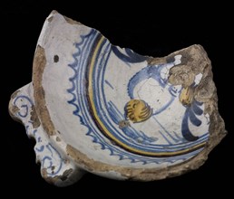 Fragment majolica dish with ears, yellow, purple and blue on white, winged cupidocup, papkom bowl crockery holder earth