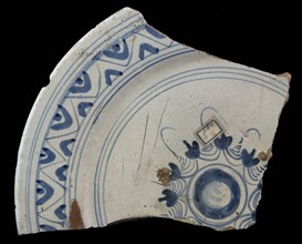 Fragment majolica plate, blue on white, stylized floral pattern or rosette on mirror, zigzag edge, plate dish crockery holder