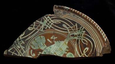 Fragment Werra plate, mirror decor with fish and plant, year 1614, pale yellow, brown and green glaze, bowl crockery holder
