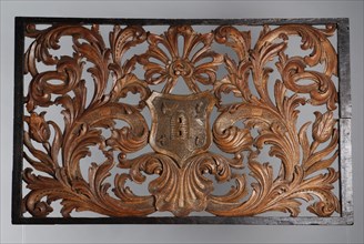 Skylight with carved leaf motifs, curling round coat of arms showing beehive and four bees, cutting frame light wood carving