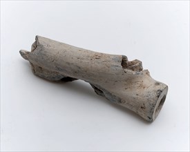 Part of object, flute With two hollow channels in it, white shard, artifact soil found clay ceramic earthenware pipe earth