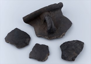 Four fragments of cooking pot with small upright ear, unglazed, gray shard, cooking pot crockery holder kitchen utensils