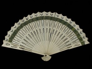 Brisé fan, leaf of carved ivory legs, briselint of dark green silk ribbon, wiséwaaier range clothing accessory women clothing