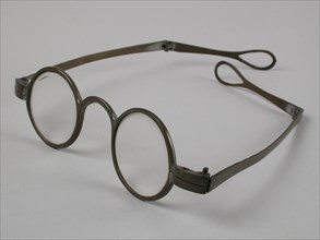 Glasses with round lenses on strength, bronze-colored metal frame, springs straight with hinged part with loop, spectacle eye