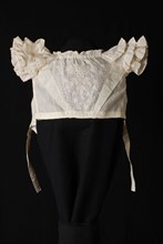 Body of christening dress, of cream-colored cotton with plumetis embroidery, short sleeves and three scalloped strips with