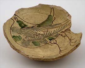Fragment white earthenware bowl with white ground and manganese bird with green accents, bowl bowl earthenware ceramics pottery