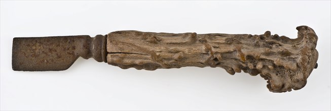 Knife with iron blade and legs raises with capriciously carved decoration, knife cutlery soil find iron bone metal, archeology