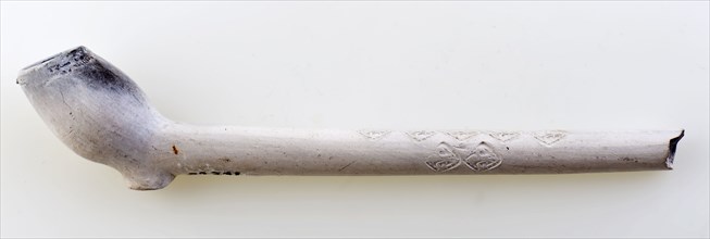Clay pipe, marked, decorated with fleur de lis stamps, clay pipe smoking equipment smoke floor pottery ceramics pottery, pressed