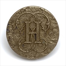 Round button with letter, Large metal button with silver colored front. Flat and disc-shaped. Faced front Faced on the reverse