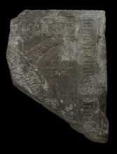 Fragment tombstone with text Gothic letters and two crossed feathers, tombstone building component stone, ca 127 kg minced flat