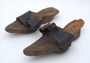 Two leather tricks with wooden soles and leather strap over the toes, shoe footwear clothing soil find leather wood, w 10.5