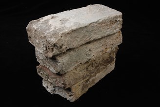 Four gray-yellow bricks from the tower or wall that were originally connected to the Schiedam gate, brick building material