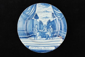 Manufacturer: De Porceleyne Bijl, Series of twelve plates with blue herring industry scenes: No 9. 't Haring banquet, plate