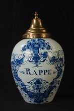 Manufacturer: De Porceleyne Schotel, Delft blue tobacco pot with copper lid and text RAPPE, tobacco pot holder ceramic pottery