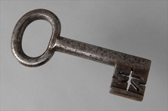 Iron key with oval eye, hollow key handle and cruciform beards in beard, key iron iron, hand forged Key with oval eye, handle