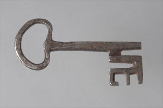 Iron key with heart-shaped eye, massive key handle and cruciform beards in beard, key iron value soil find? iron, hand forged