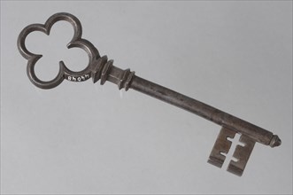 Decorated key with cloverleaf shaped eye, massive key handle and cruciform beards in beard, key iron iron, hand forged Key