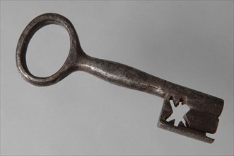 Iron key with oval eye, hollow key handle and cruciform beards in beard, key iron value soil find iron, hand forged Key