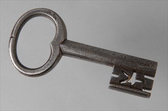 Iron key with heart-shaped eye, hollow key handle and cruciform beards in beard, key iron value soil find?, hand forged Key