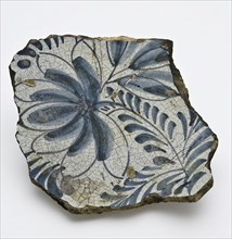 Fragment of majolica dish, mirror with flower in blue, dish crockery holder soil find ceramic pottery glaze tin glaze lead glaze