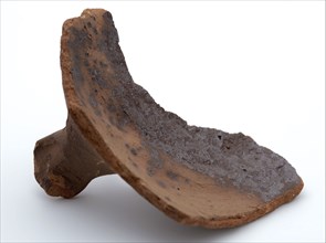 Fragment of red earthenware, partly with glaze, fragment crockery holder kitchen utensils earthenware ceramics pottery glaze