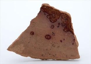 Fragment of red pottery, partly with glaze, fragment crockery holder kitchen utensils earthenware ceramics earthenware glaze