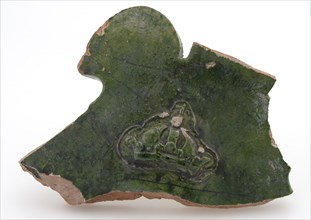 Green fragment of earthenware fire dome with crown in relief, firecock fireplaces earthenware ceramic pottery clay engobe glaze