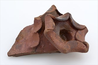 Fragment of earthenware fire dome with molded rosette, glazed, firecock fragment earth discovery ceramic earthenware glaze lead