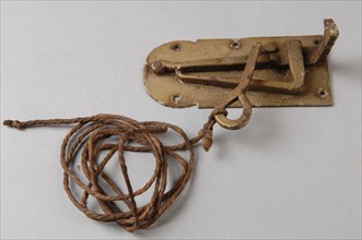 Small painted metal latch with spring and pull arm on base plate, on eye rope which can be used as kind of pulling arm, latch